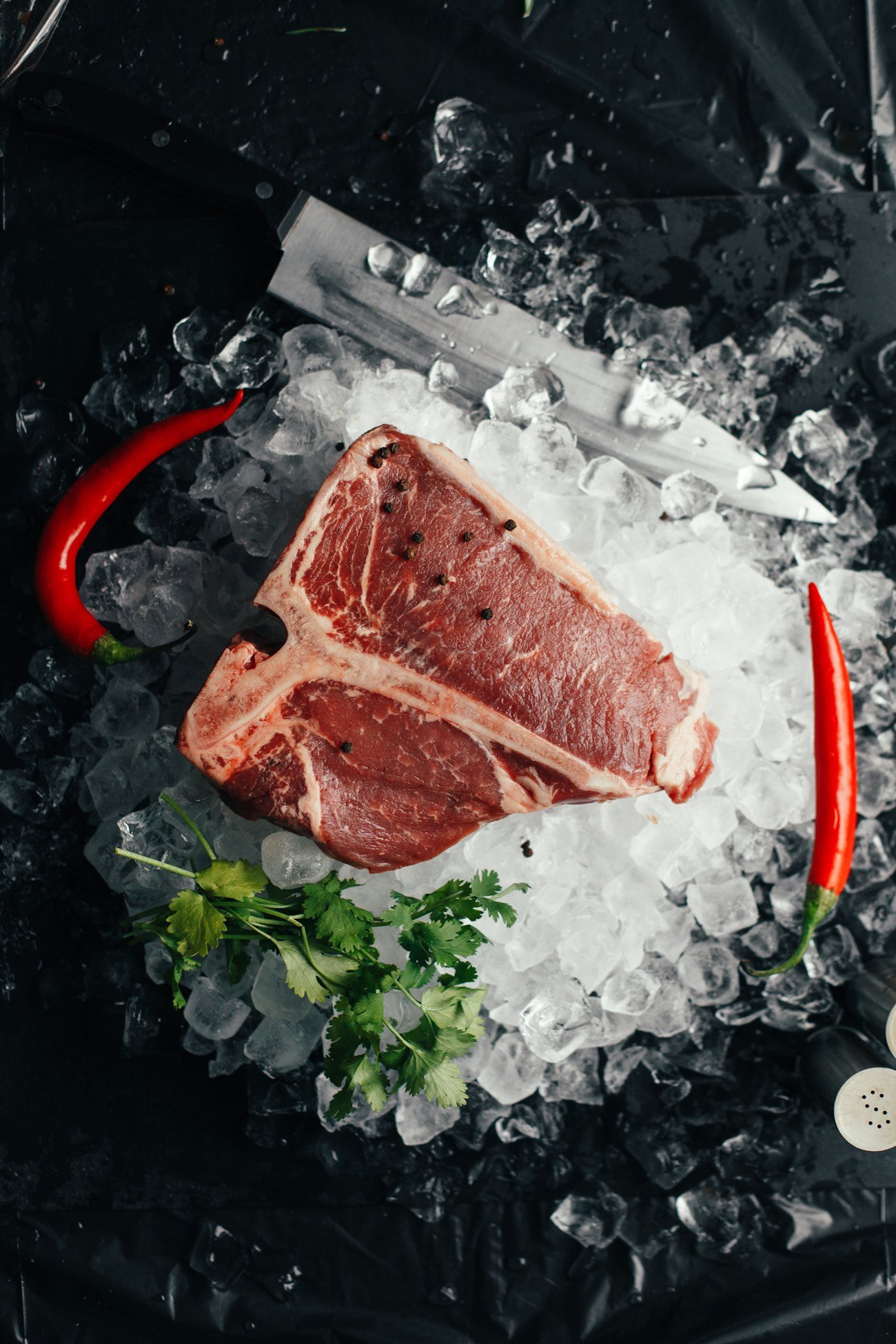 T-bone steak resting on crushed ice
