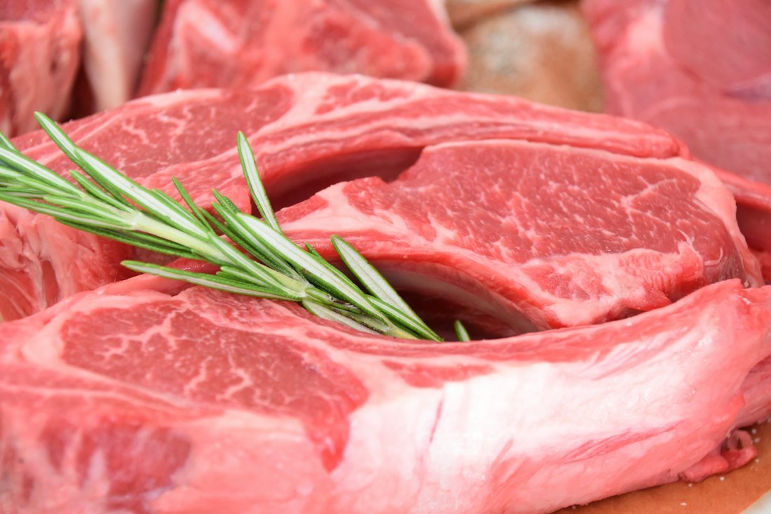 Raw marbled meat cuts with rosemary